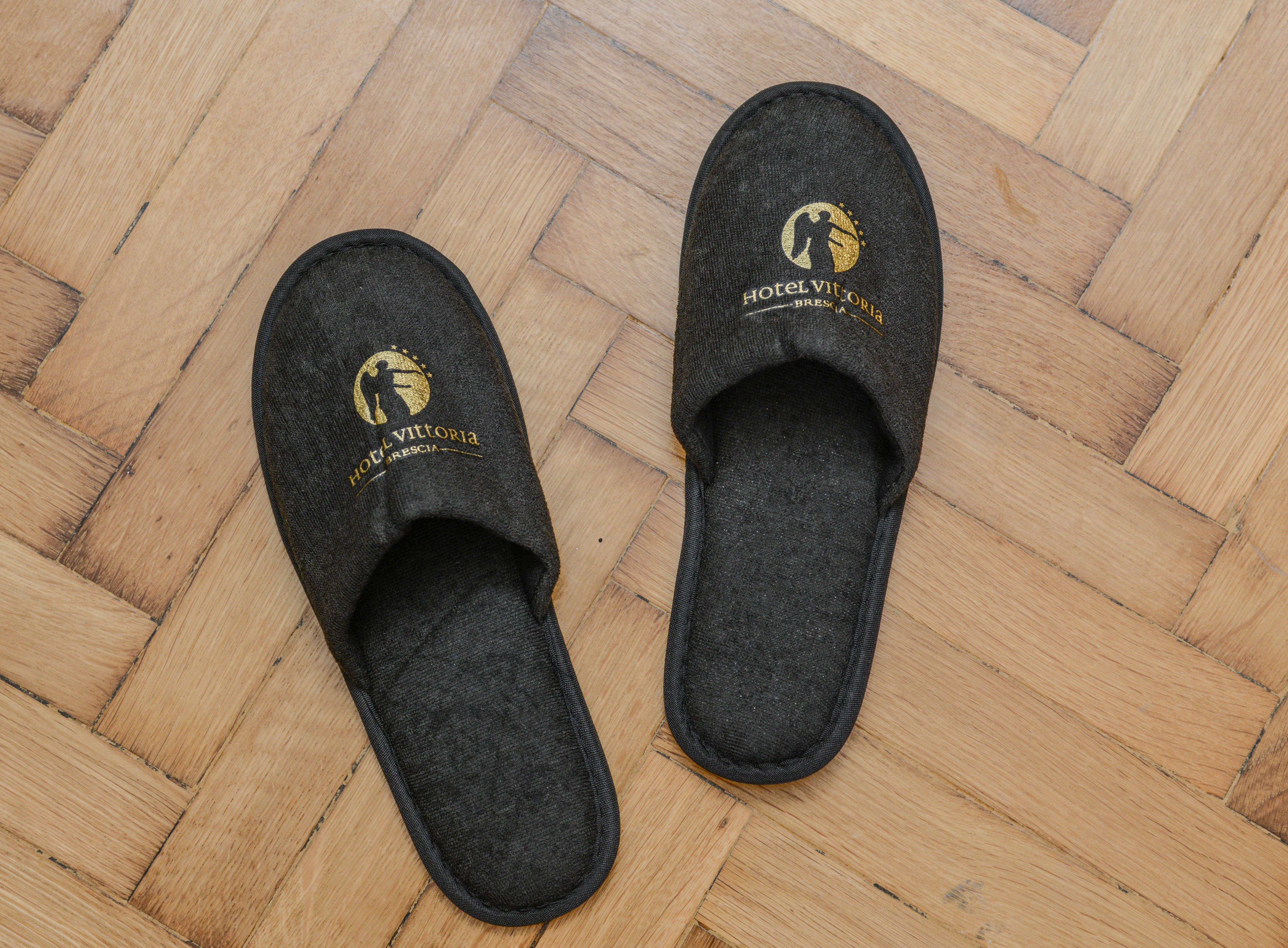 Hotel Vittoria Brescia Exterior photo A pair of hotel slippers